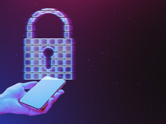 Close up of female hand holding mobile phone with glowing digital padlock hologram on dark purple background with mock up place. Secure and web safety concept.